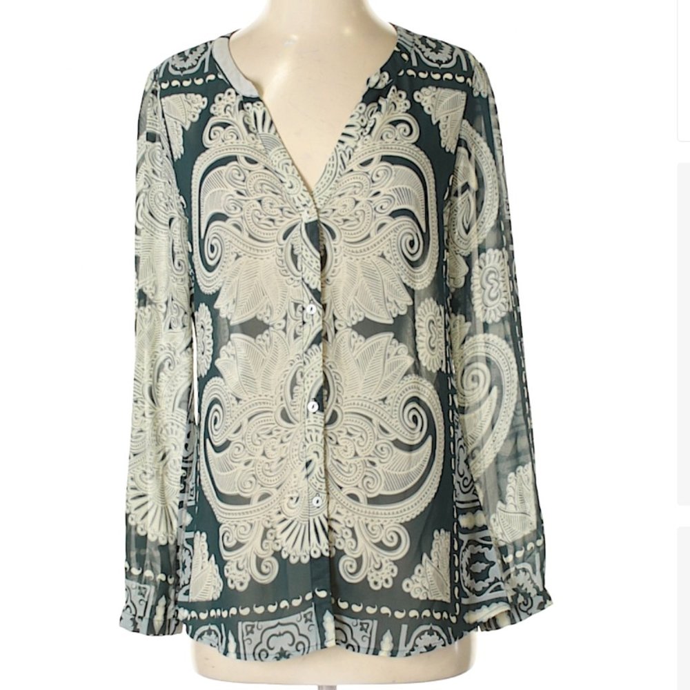 Sheer green-and-white patterned blouse